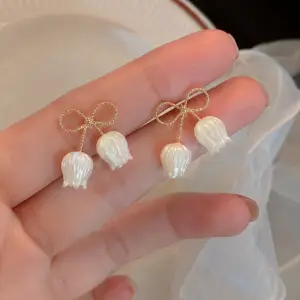 Pearl earrings, bow earrings, coquette style, aesthetic jewelry, Korean jewelry, cute earrings, trending jewelry, viral product, fashion accessories, minimal jewelry, elegant style, girls accessories, pearl drop earrings, jewelry lover, Pinterest style, luxury look, Gen Z fashion, statement earrings, jewelry trend, Pakistani fashion, cute accessories, bow trend, soft girl aesthetic, limited stock, gift for her, fashion jewelry, Luvora PK, earrings for girls, trending now