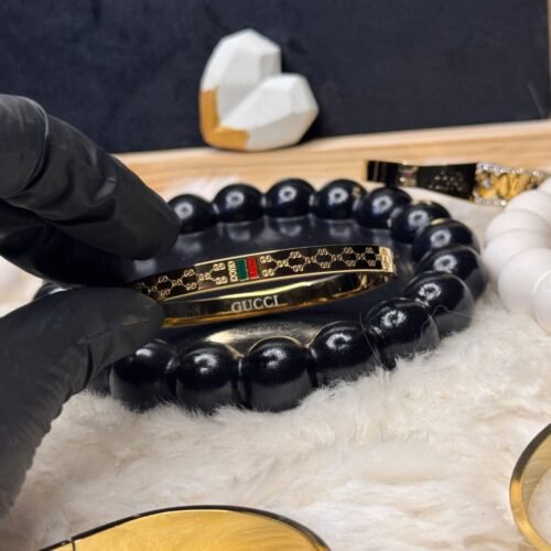 Luxury Inspired Gold Handcuff – Red & Green Detail