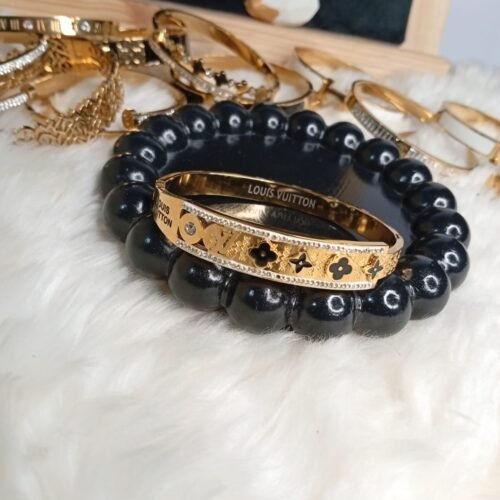 Luxury Inspired Gold Handcuff – Black & Gold Detail